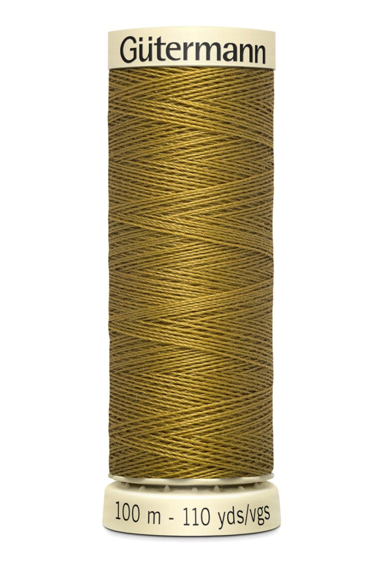 A spool of Gütermann thread in a rich golden brown color. The label indicates it contains 100 meters or 110 yards of thread.