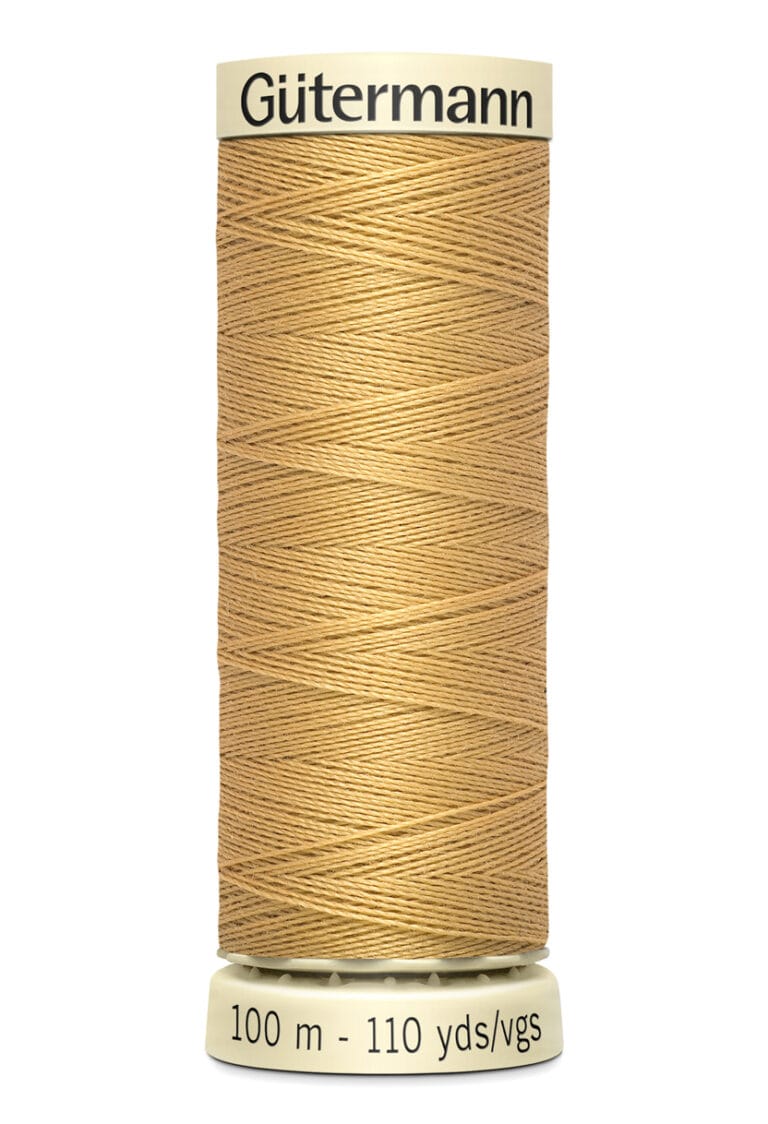 A spool of Gütermann thread in light brown color, with the label showing 100 meters (110 yards). The spool is cylindrical with cream-colored ends.