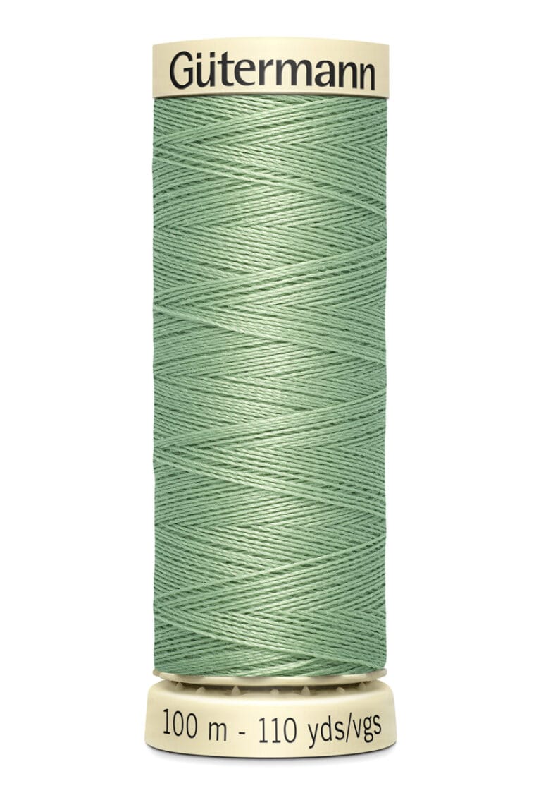 A spool of Gütermann sewing thread in light green, containing 100 meters or 110 yards. The spool has cream-colored ends with the brand name written on the top.