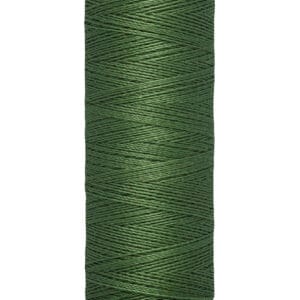 Spool of Gütermann thread with 100 meters (110 yards) of dark green thread, shown against a white background.