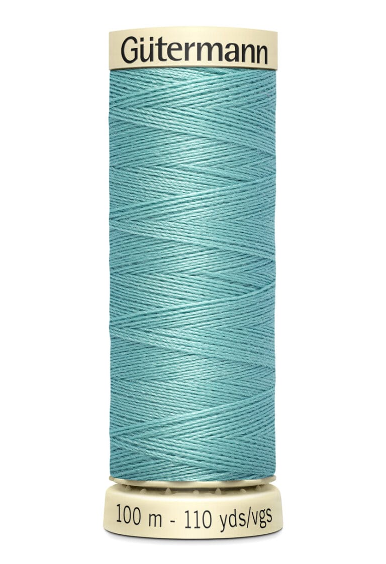 A spool of Gütermann thread in teal blue. The label shows the length as 100 meters or 110 yards. The spool is set against a white background.