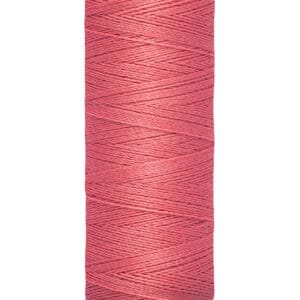 A spool of Gütermann pink sewing thread, labeled with 100 meters or 110 yards.