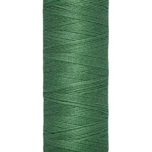 A spool of Gütermann green sewing thread is shown. The label indicates it contains 100 meters or 110 yards of thread.