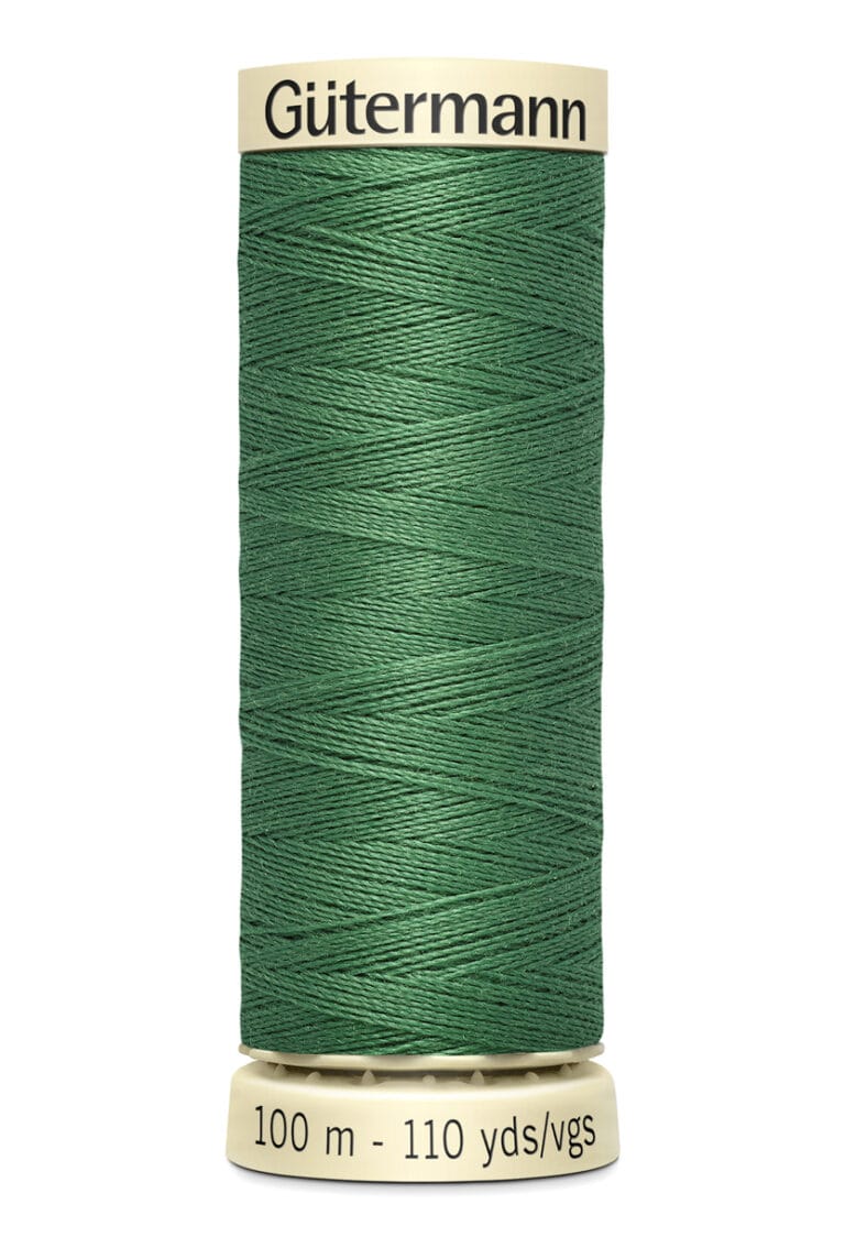 A spool of Gütermann green sewing thread is shown. The label indicates it contains 100 meters or 110 yards of thread.