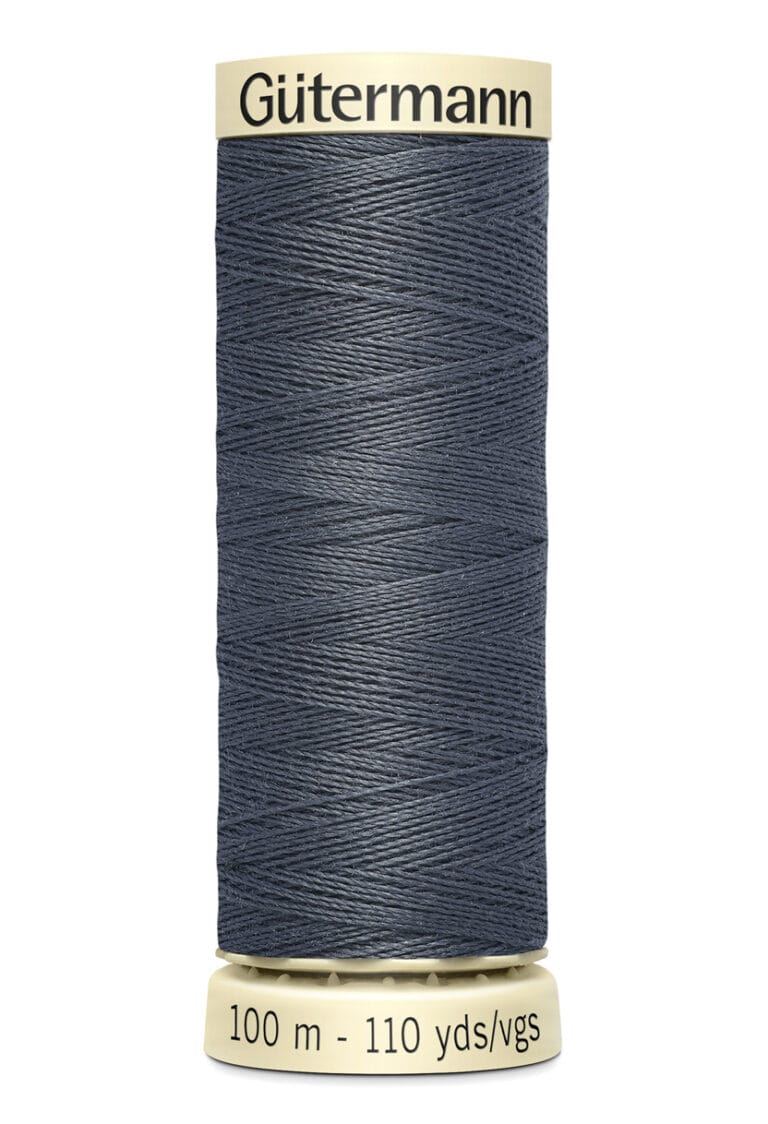 A spool of Gütermann sewing thread, dark gray in color, with labels indicating it contains 100 meters or 110 yards of thread. The spool has a beige top and bottom.