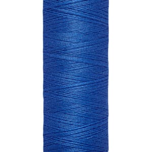 A spool of Gütermann blue sewing thread, labeled with "100 m - 110 yds/vgs". The thread is tightly wound on a beige plastic reel, with the brand name printed on the top.
