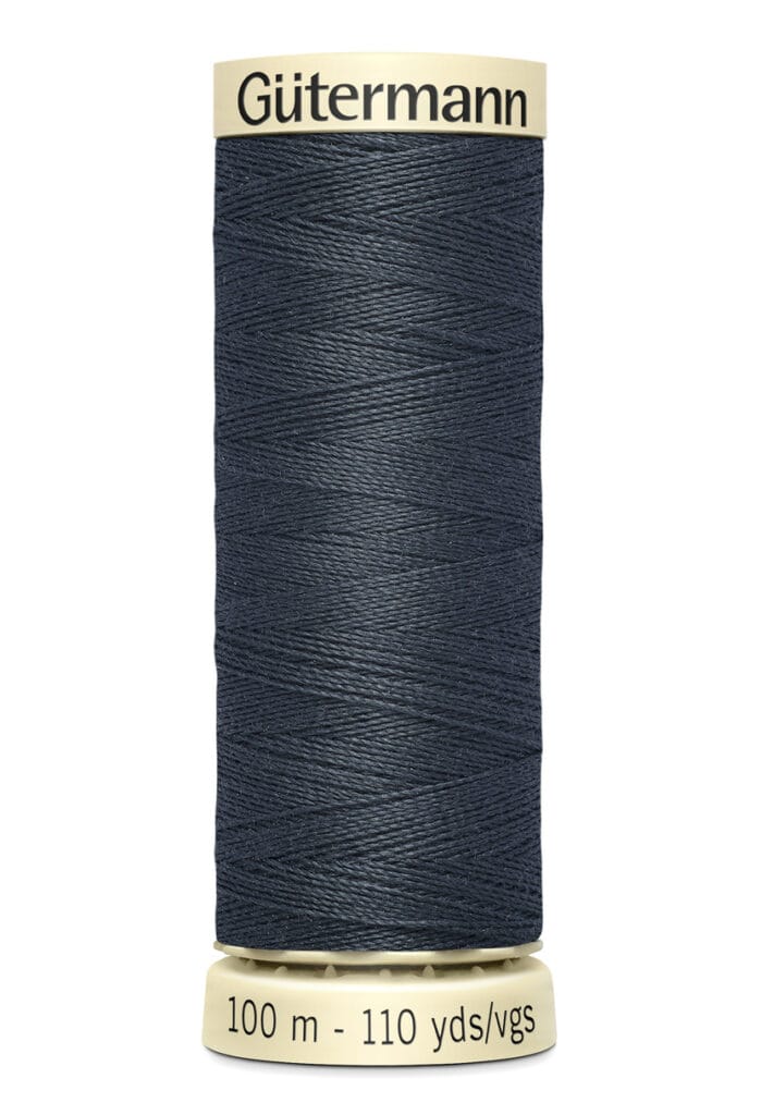 A spool of Gütermann sewing thread, dark blue in color, labeled with "100 m - 110 yds/vgs" at the bottom.