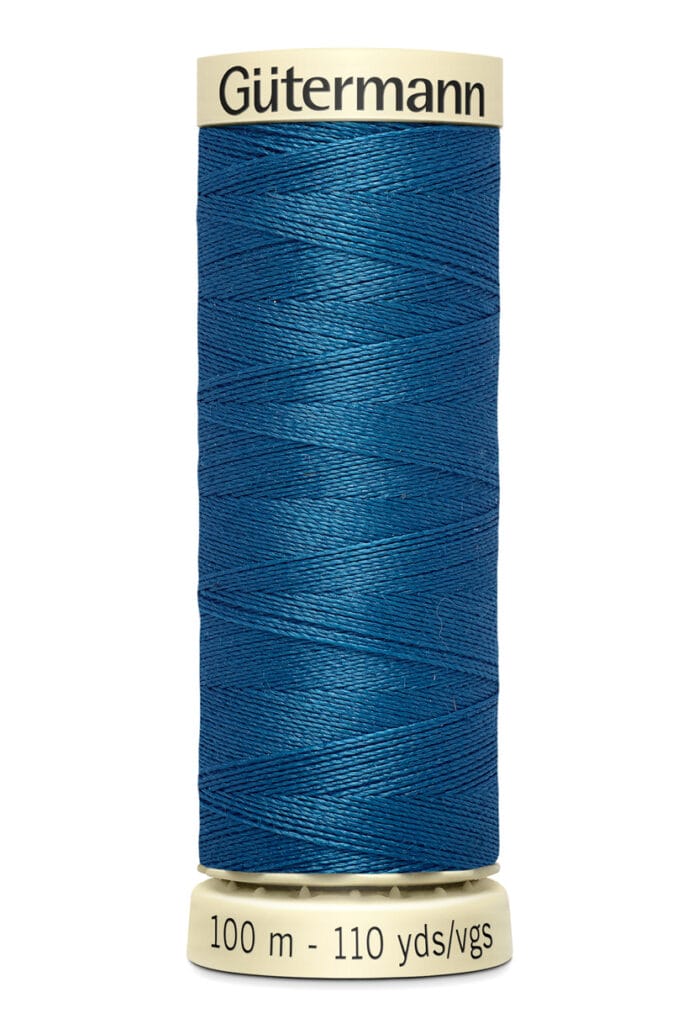 A spool of Gütermann thread, blue in color, with a label at the bottom indicating 100 meters or 110 yards.