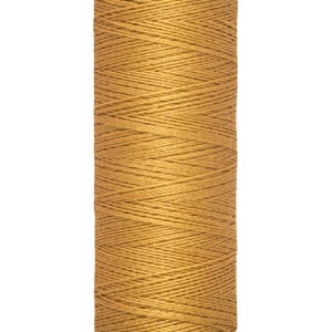 A spool of Gütermann sewing thread in a warm tan color, labeled with "100 m - 110 yds" at the base.