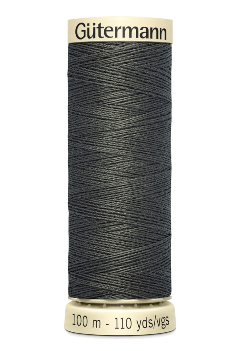 A spool of Gütermann sewing thread, black in color, wound tightly. The label indicates 100 meters or 110 yards in length.