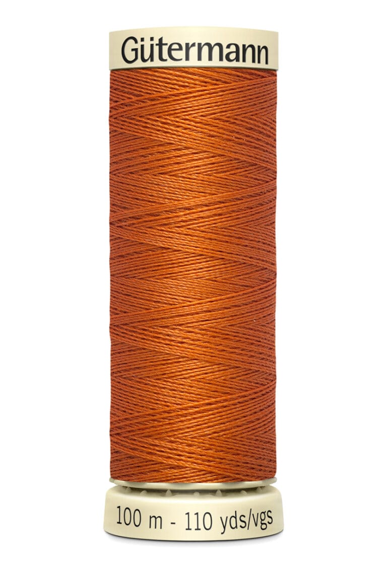 A spool of Gütermann thread in a deep orange color. It is labeled with "100 m - 110 yds/vgs" at the bottom.