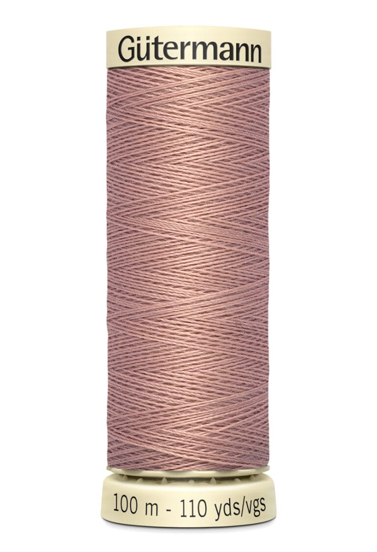 A spool of Gütermann thread is displayed, featuring a soft pink color. The spool is marked with 100 meters and 110 yards.