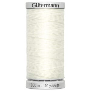 A spool of Gütermann sewing thread with white thread wrapped around it. The spool indicates that it contains 100 meters or 110 yards of thread.