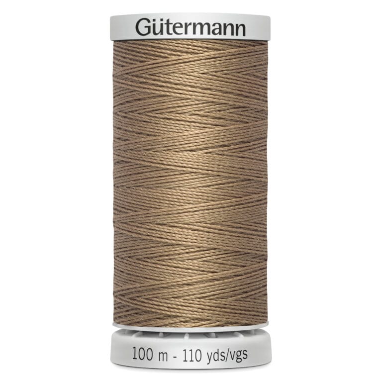 A spool of Gütermann thread, 100 meters (110 yards), in a beige color. The thread is neatly wound around a cylindrical white plastic spool.