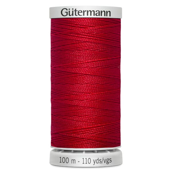 Red spool of Gütermann sewing thread on a white background, labeled "100 m - 110 yds/vgs.