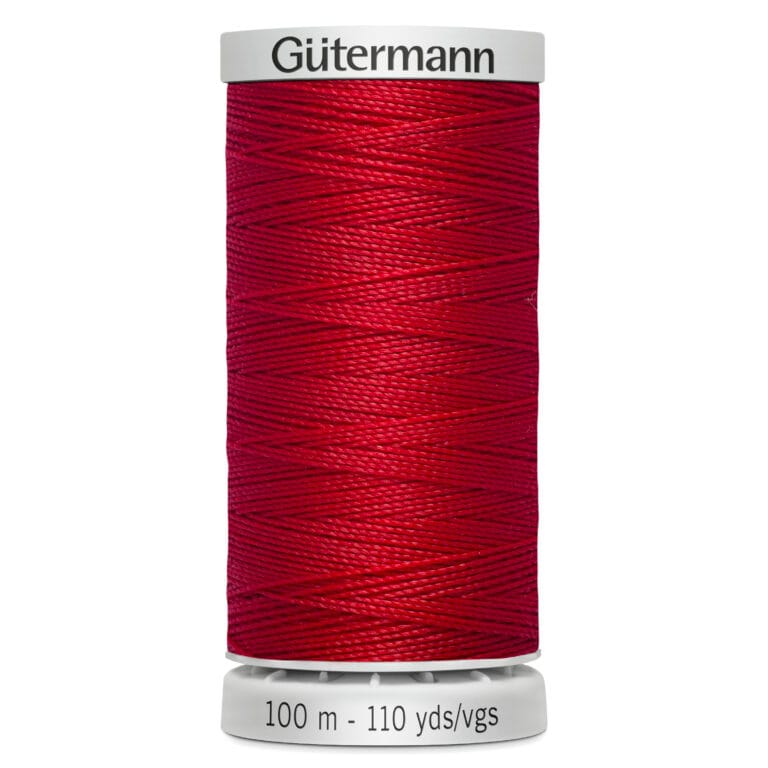 Red spool of Gütermann sewing thread on a white background, labeled "100 m - 110 yds/vgs.