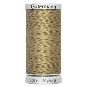 A spool of Gütermann thread in a light brown color. The label indicates the length as 100 meters or 110 yards.