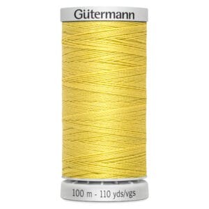 A spool of Gütermann yellow thread, labeled with "100 m - 110 yds/vgs," is vertically positioned against a white background. The thread is tightly wound across the spool.