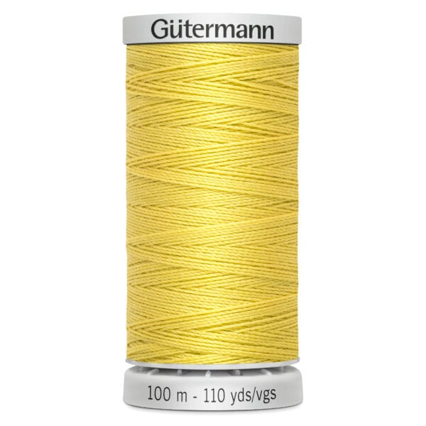 A spool of Gütermann yellow thread, labeled with "100 m - 110 yds/vgs," is vertically positioned against a white background. The thread is tightly wound across the spool.