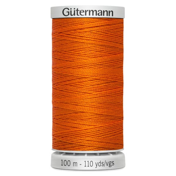 A spool of Gütermann thread in bright orange. The spool displays the brand name on top and indicates 100 meters or 110 yards at the bottom. The thread is neatly wound around the cylindrical spool.