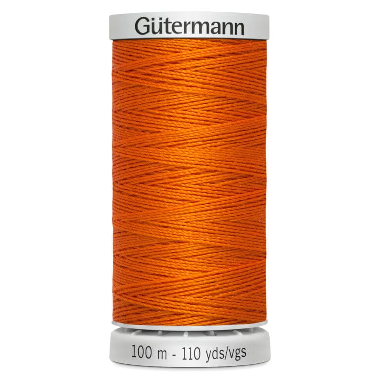 A spool of Gütermann thread in bright orange. The spool displays the brand name on top and indicates 100 meters or 110 yards at the bottom. The thread is neatly wound around the cylindrical spool.