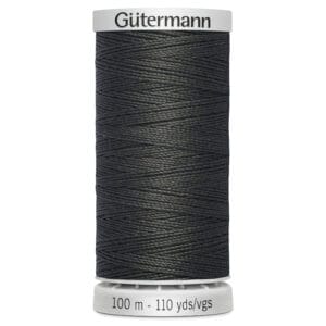 A spool of Gütermann sewing thread in a dark color. The label indicates the thread length as 100 meters or 110 yards.