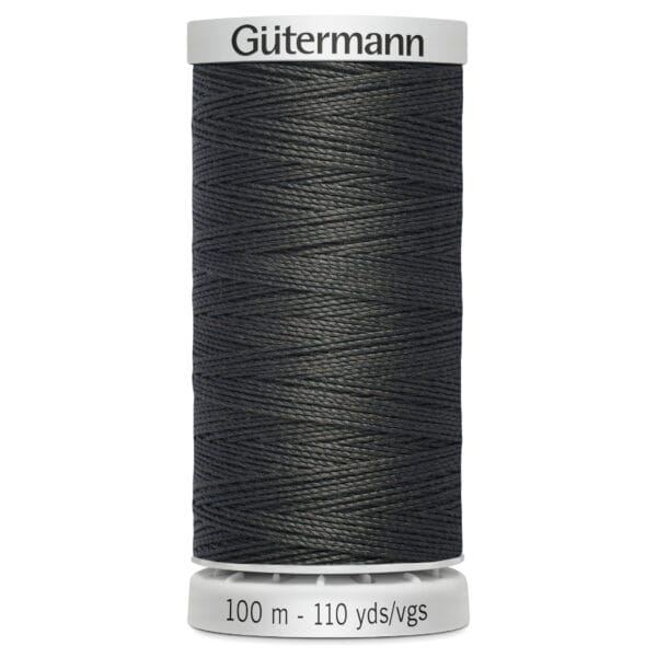A spool of Gütermann sewing thread in a dark color. The label indicates the thread length as 100 meters or 110 yards.