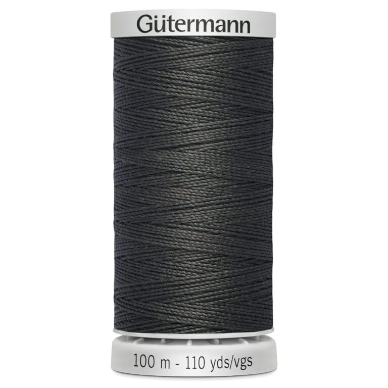 A spool of Gütermann sewing thread in a dark color. The label indicates the thread length as 100 meters or 110 yards.