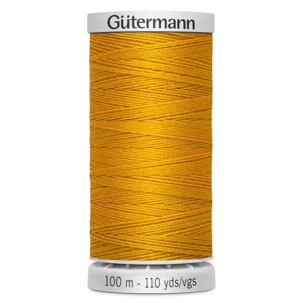 A spool of Gütermann thread, colored in a vibrant mustard yellow. The spool shows 100 meters or 110 yards on its label.