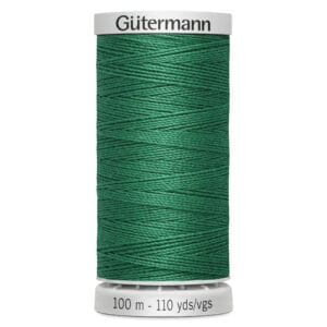 A spool of Gütermann sewing thread in a rich green color, labeled with 100 meters and 110 yards. The spool has white caps on the top and bottom.