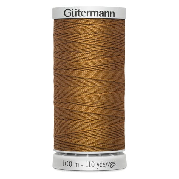 Spool of Gütermann thread in golden brown, labeled as 100 meters or 110 yards.