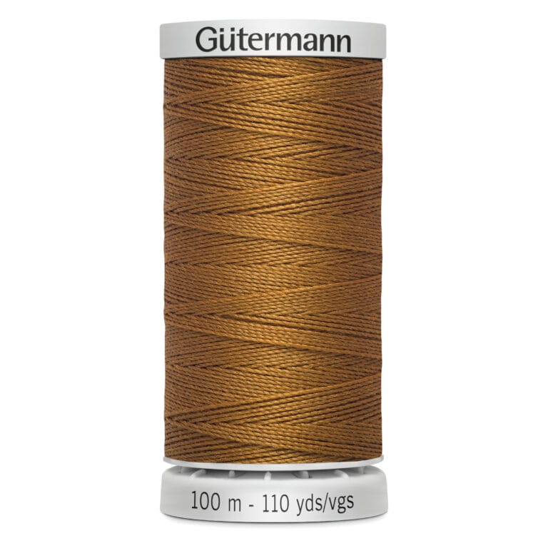 Spool of Gütermann thread in golden brown, labeled as 100 meters or 110 yards.