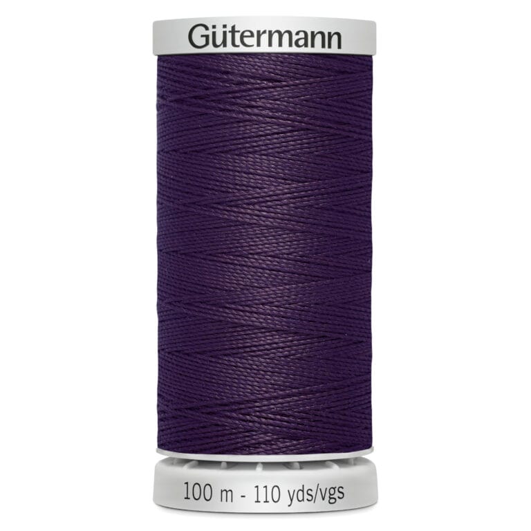A spool of Gütermann thread in dark purple color. The label shows the length as 100 meters or 110 yards. The spool has a white top and base, with the brand name printed on the top.