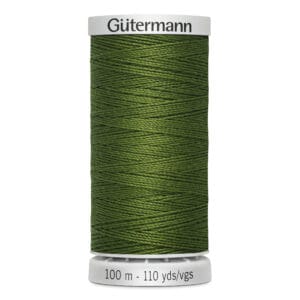 A spool of green Gütermann sewing thread, labeled with "100 m - 110 yds" on the base. The thread is tightly wound around a white cylindrical holder.