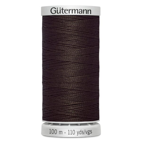 A spool of Gütermann sewing thread, dark brown in color, labeled as 100 meters or 110 yards. The spool has a white top and bottom.