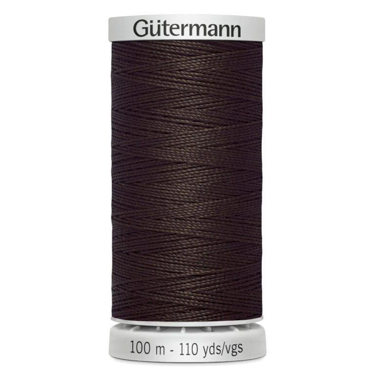 A spool of Gütermann sewing thread, dark brown in color, labeled as 100 meters or 110 yards. The spool has a white top and bottom.