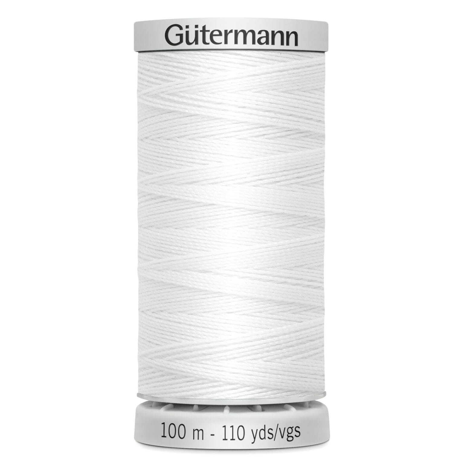 A spool of white Gütermann thread, labeled with "100 m - 110 yds/vgs," stands upright, showcasing its tightly wound texture.