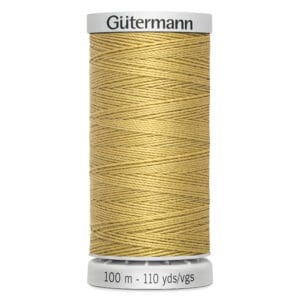 A spool of Gütermann thread in a light beige color, neatly wound. The spool displays measurements: 100 meters and 110 yards.