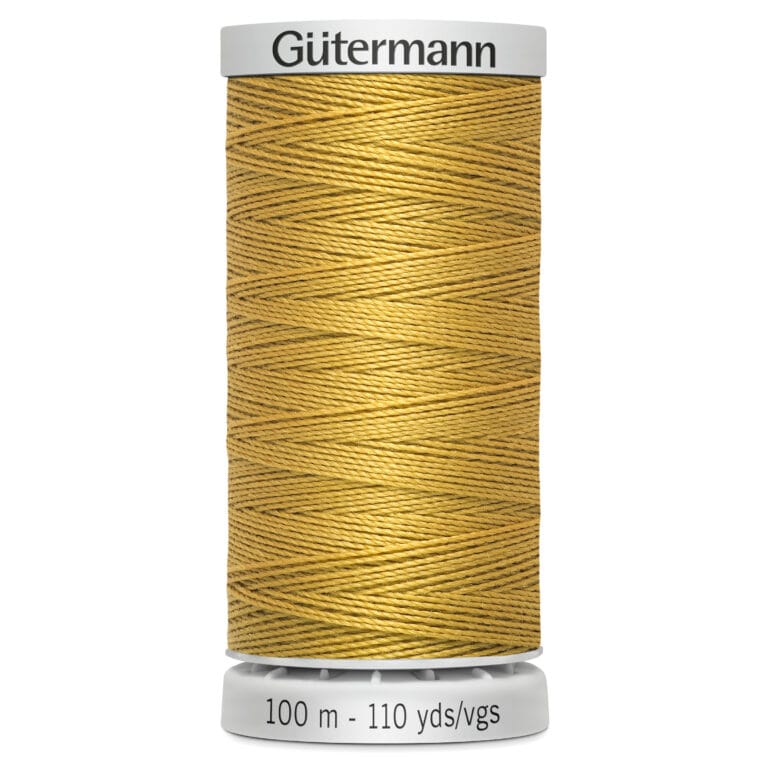 Spool of Gütermann gold sewing thread, 100 meters or 110 yards in length, with thread neatly wound in a crisscross pattern on a cylindrical holder.