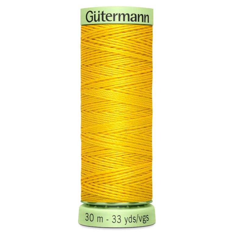 A spool of Gütermann sewing thread in bright yellow, wrapped neatly around a cylindrical holder. The holder is light green with measurements printed at the base, indicating 30 meters or 33 yards.