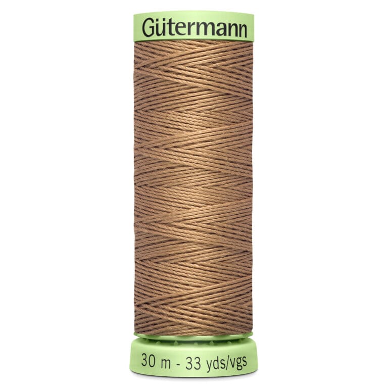 Spool of Gütermann brown sewing thread labeled with "30 m - 33 yds/vgs." The spool has a green top and bottom, with thread neatly wound in a crisscross pattern.