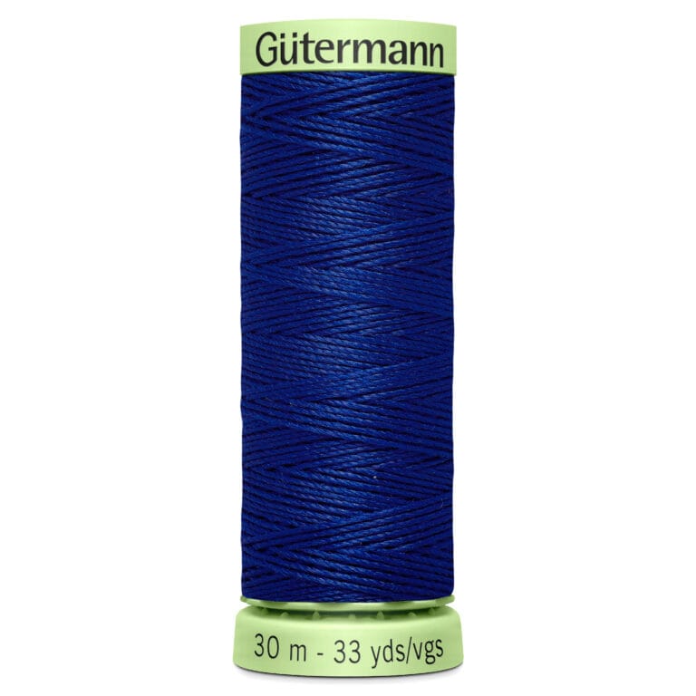 A spool of Gütermann blue thread, labeled with measurements of 30 meters and 33 yards. The spool has a light green top and bottom where the brand name and thread length are printed.