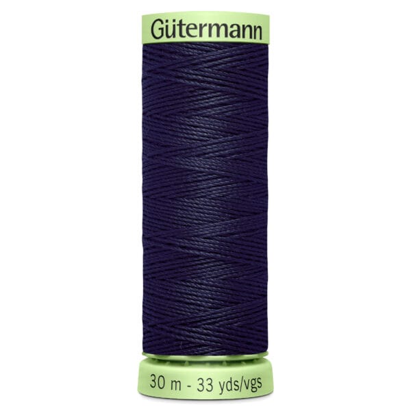 A spool of dark blue Gutermann thread, wrapped neatly, with a light green cap and base. The base is labeled "30 m - 33 yds/vgs.