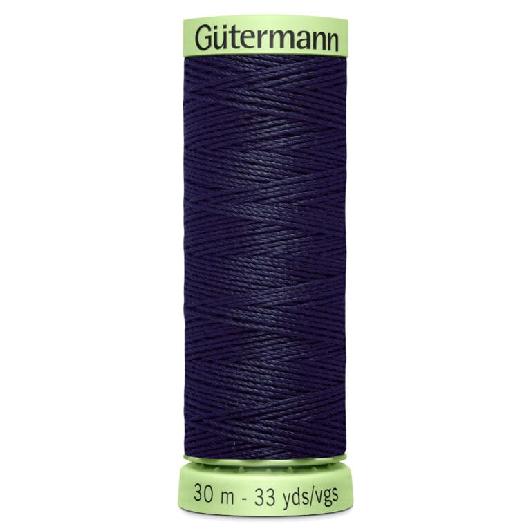 A spool of dark blue Gutermann thread, wrapped neatly, with a light green cap and base. The base is labeled "30 m - 33 yds/vgs.