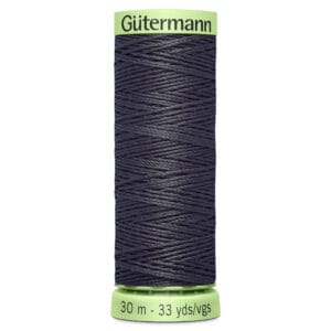 A spool of Gütermann sewing thread in dark grey. The spool has a light green top and bottom, with text indicating the length: 30 meters or 33 yards.