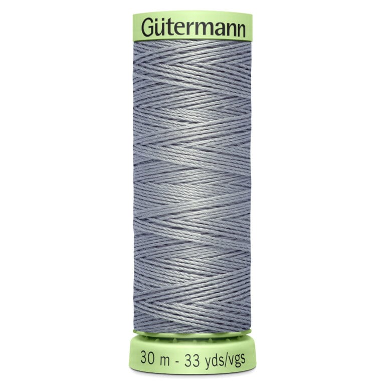 A spool of Gütermann thread in grey, featuring 30 meters or 33 yards of thread. The spool is predominantly grey with light green ends, displaying the brand name at the top and length information at the bottom.