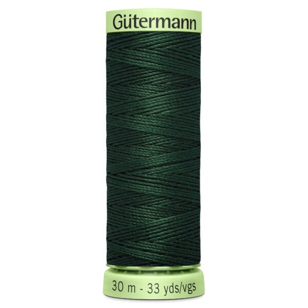 A spool of Gutermann thread in dark green. The spool is labeled with "Gutermann" on the top and indicates a length of 30 meters or 33 yards on the bottom.