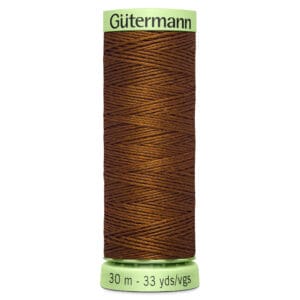 Brown spool of Gütermann thread, labeled "30 m - 33 yds/vgs" on a lime green base.