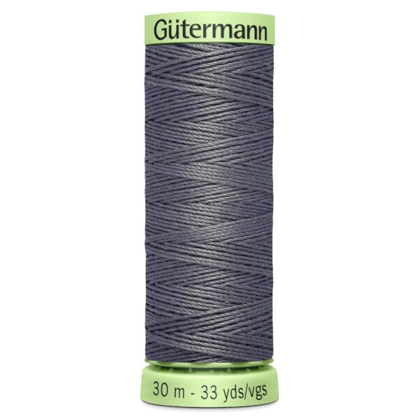 A spool of dark gray Gütermann sewing thread, labeled with "30 m - 33 yds/vgs" on a green base, is shown against a white background.