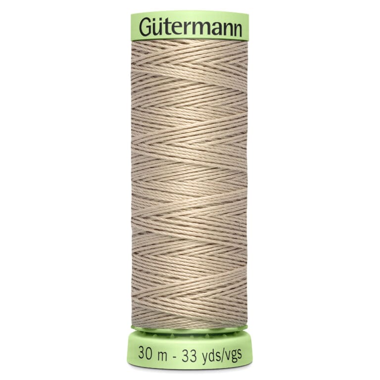 A spool of Gütermann beige thread, 30 meters or 33 yards long, with a green label at the top and bottom.